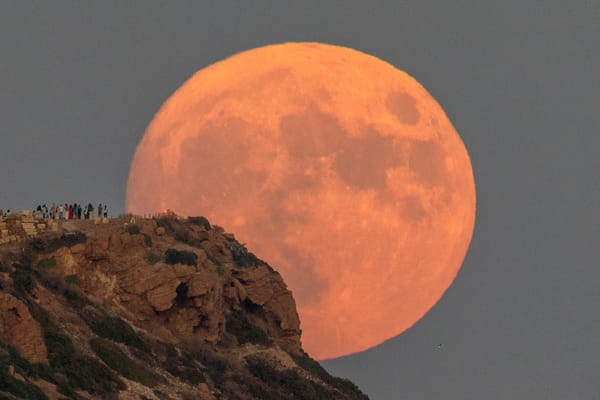 Full moon rises behind the Temple of Poseidon in Cape Sounion, Reuters